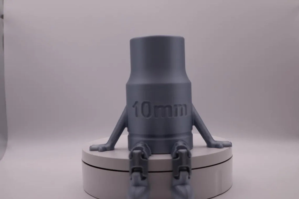 Gray cylindrical object with '10mm' marking on a white background