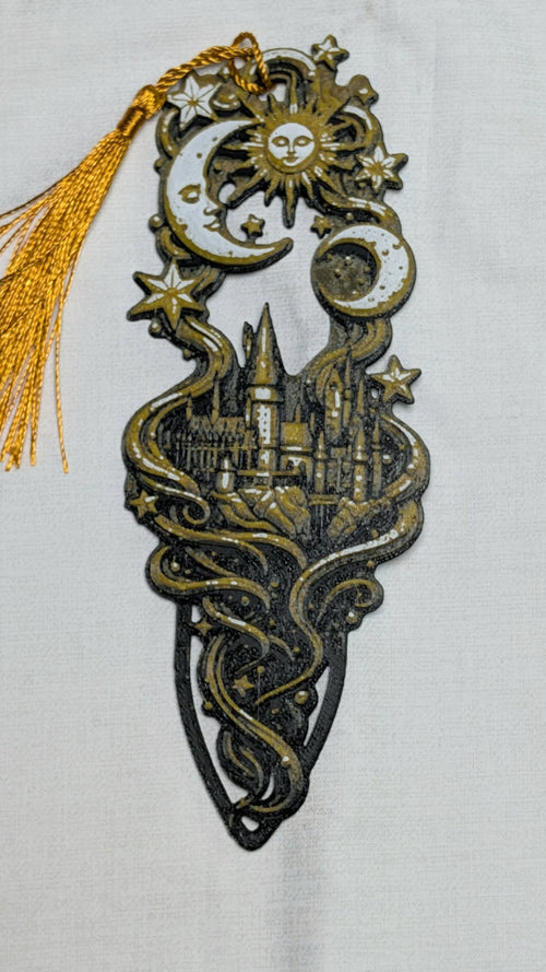Decorative bookmark with celestial design and castle silhouette on a white background