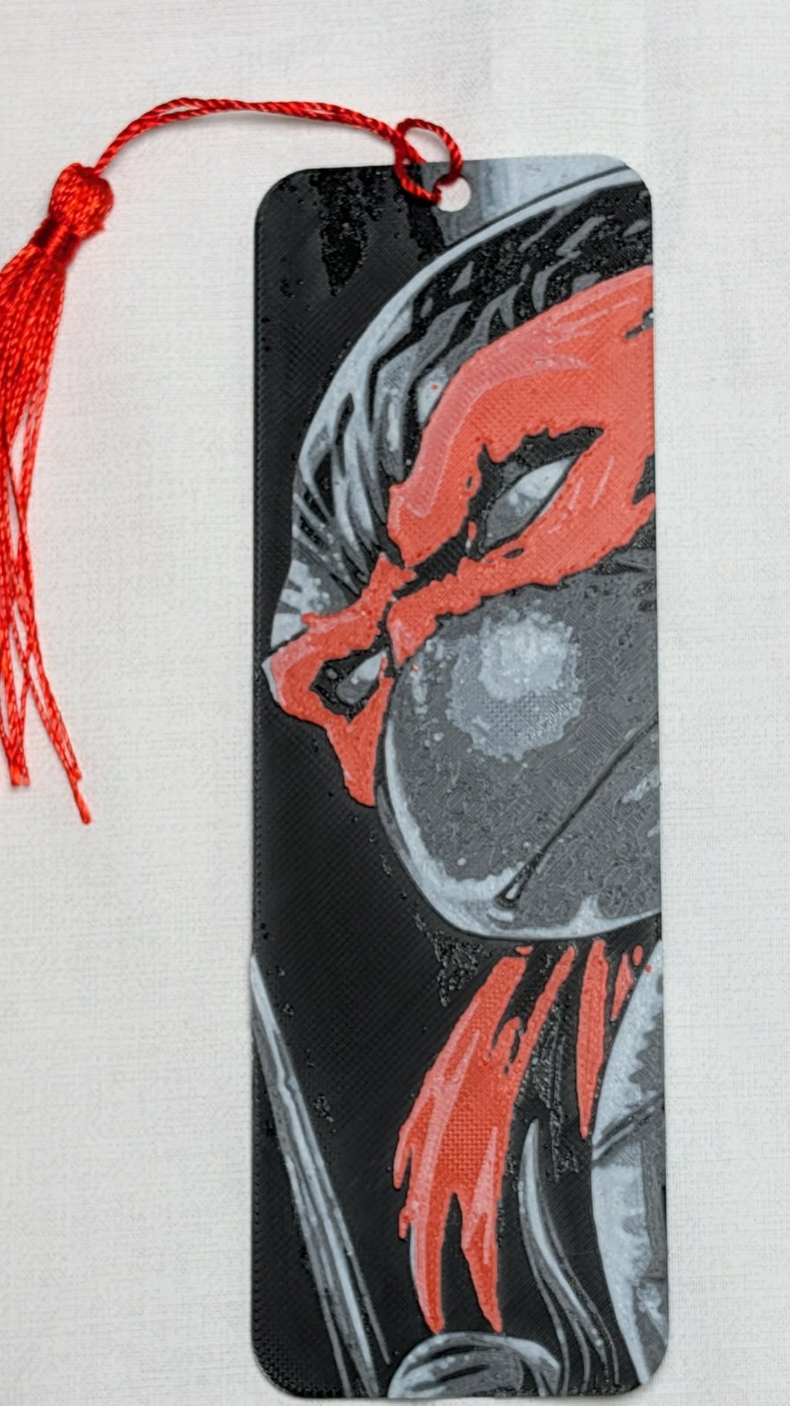 Bookmark with red and gray design on a white background