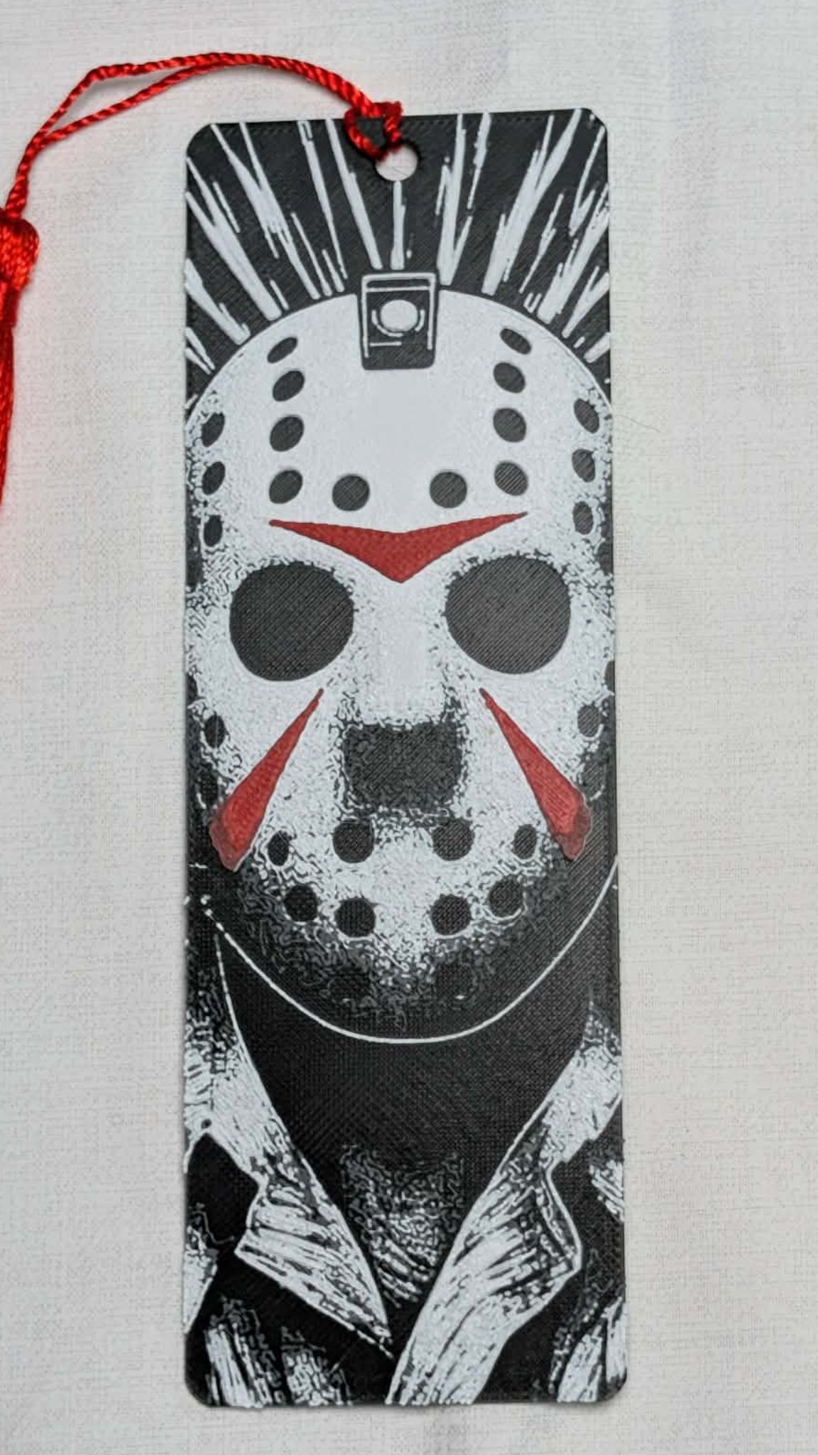 Bookmark with a hockey mask design on a white background