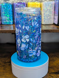 Tumbler with blue floral design on a wooden surface