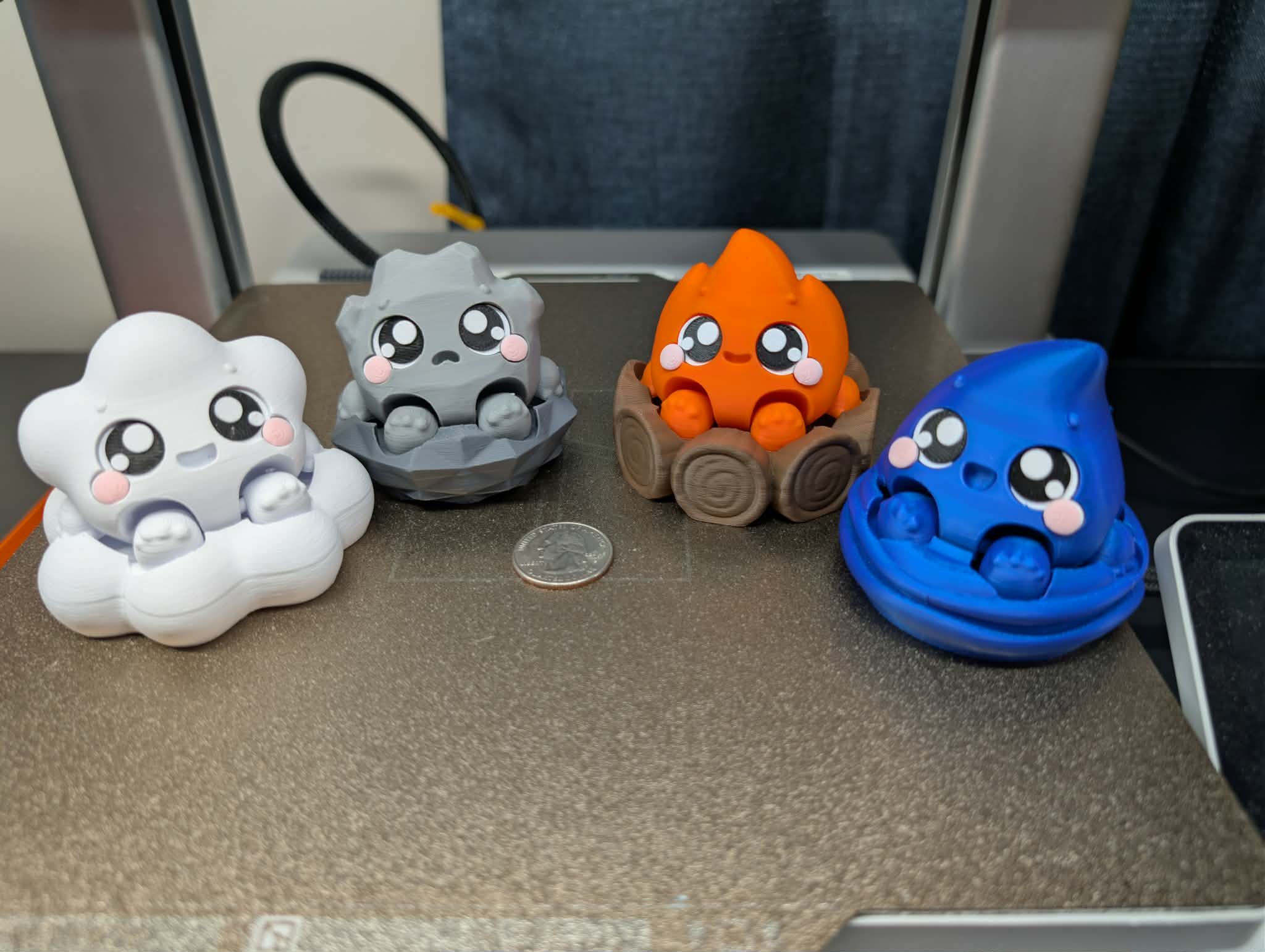 Set of four elemental fidget clickers including fire, water, wind, and stone 3D printed desk fidgets