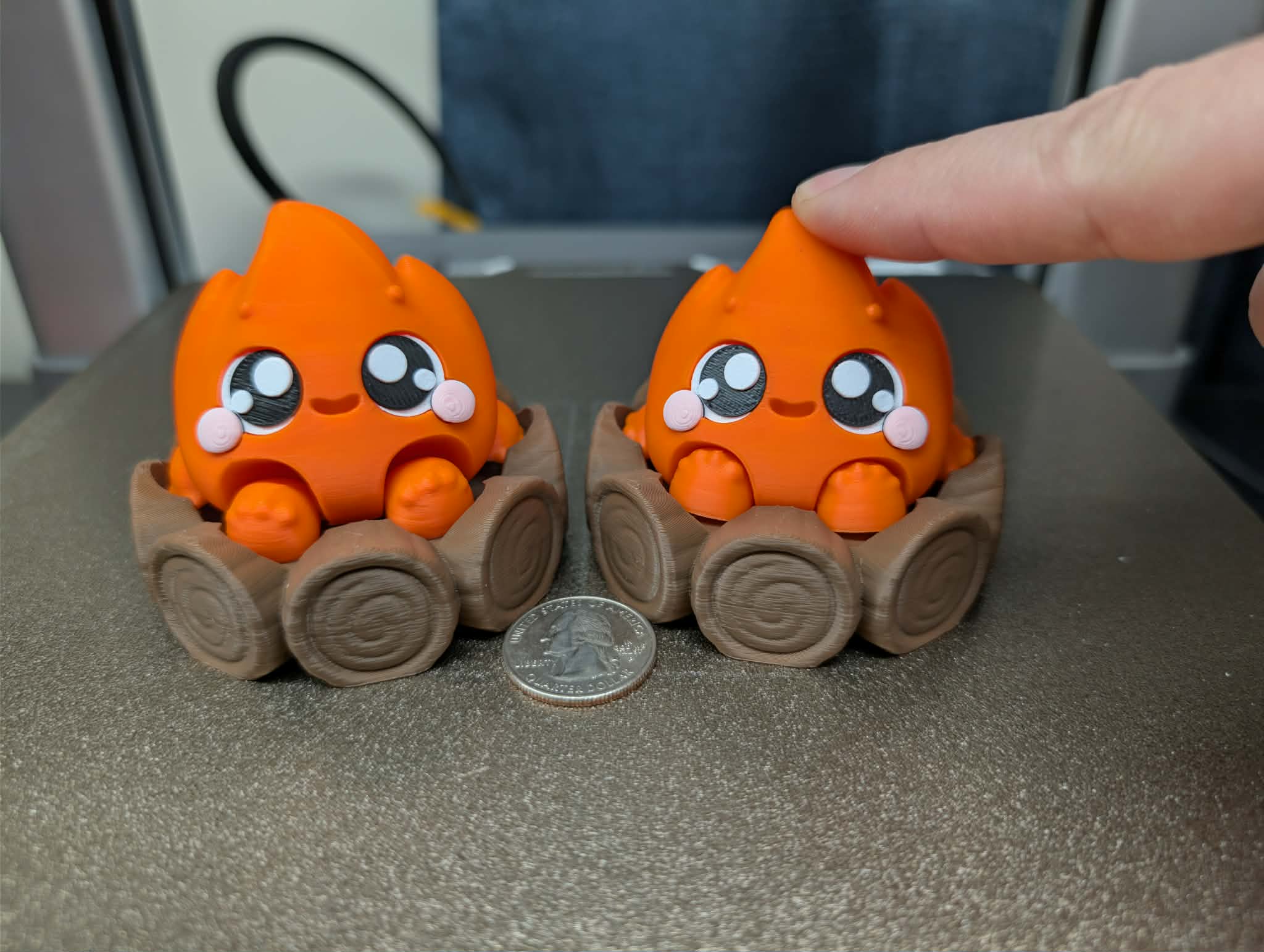 Fire elemental fidget clicker 3D printed desk toy with flame character and wood base