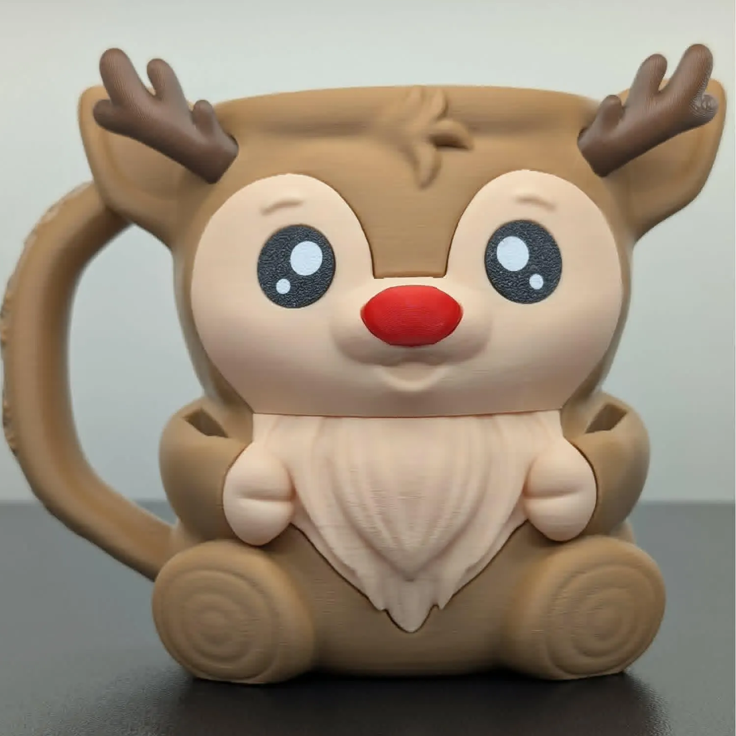 Reindeer-shaped mug with a plain background