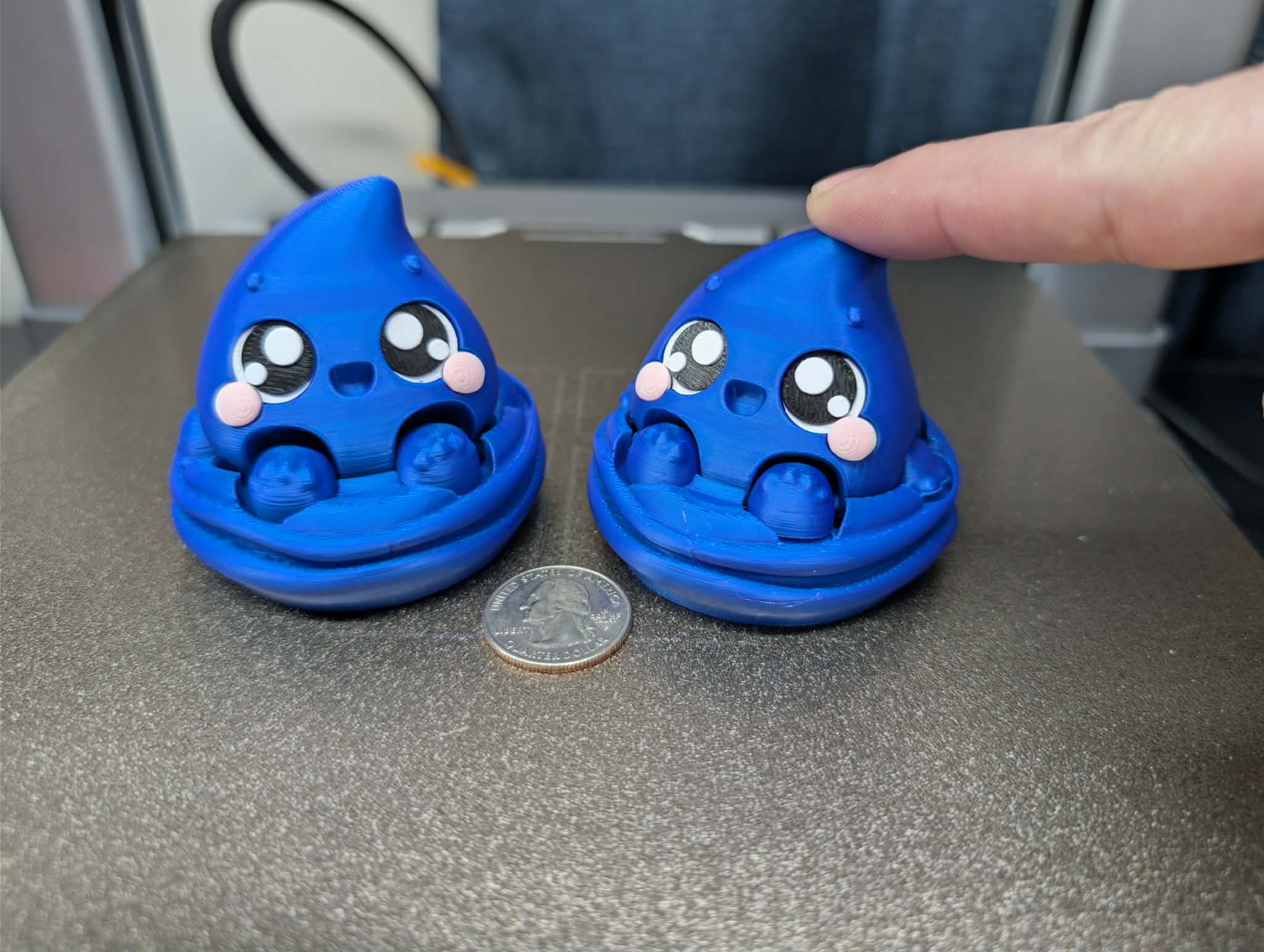 Water elemental fidget clicker 3D printed desk fidget with blue droplet character